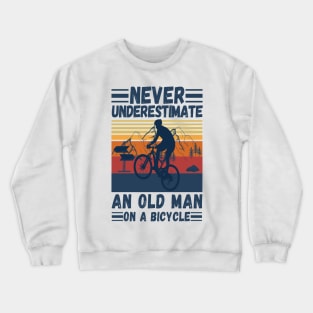 never underestimate an old man on a bicycle Crewneck Sweatshirt